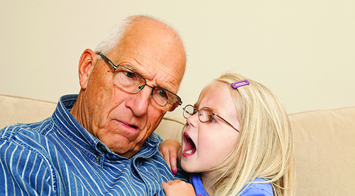 Child Girl Yelling into Grandfather's Ear