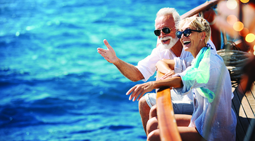 Senior couple on a sailing cruise.